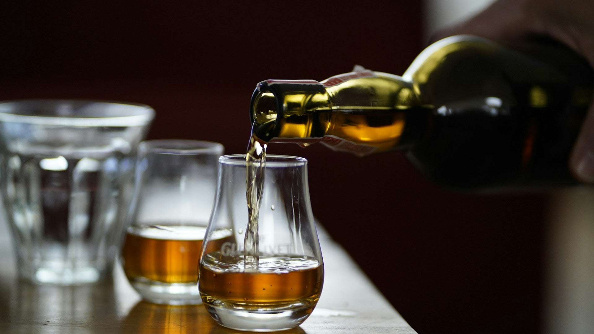 Whisky being poured into a nosing glass