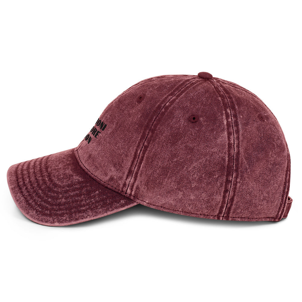 Maroon vintage cotton twill cap from Fine Spirits Consulting, shown from the left side with classic stitching and curved brim.