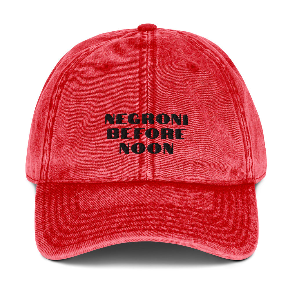 Red vintage cotton twill cap with a curved brim and adjustable strap, featuring classic stitching and a stylish retro look.